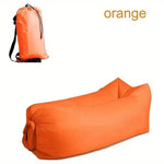 Load image into Gallery viewer, Orange inflatable sofa and carrying bag on a white background
