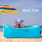 Load image into Gallery viewer, Person sitting on a blue inflatable lounger under a colorful umbrella with &#39;good time&#39; text on a beach.
